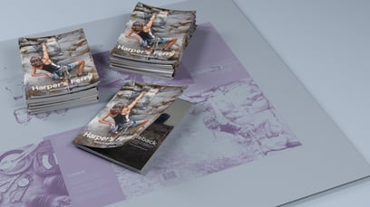 A few stacks of magazines sitting on a KODAK SONORA XTRA Process Free printing plate.